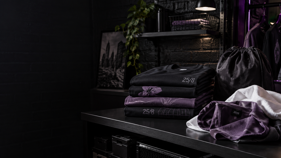 Folded graphic shirts and a garment care bag
