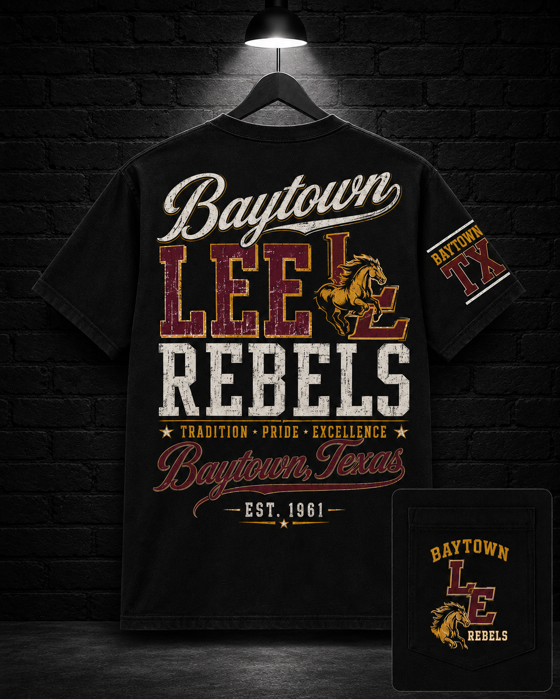 Baytown Lee School Spirit Graphic Tee on the 25/8 matte black brick studio background with black hanger and overhead spotlight