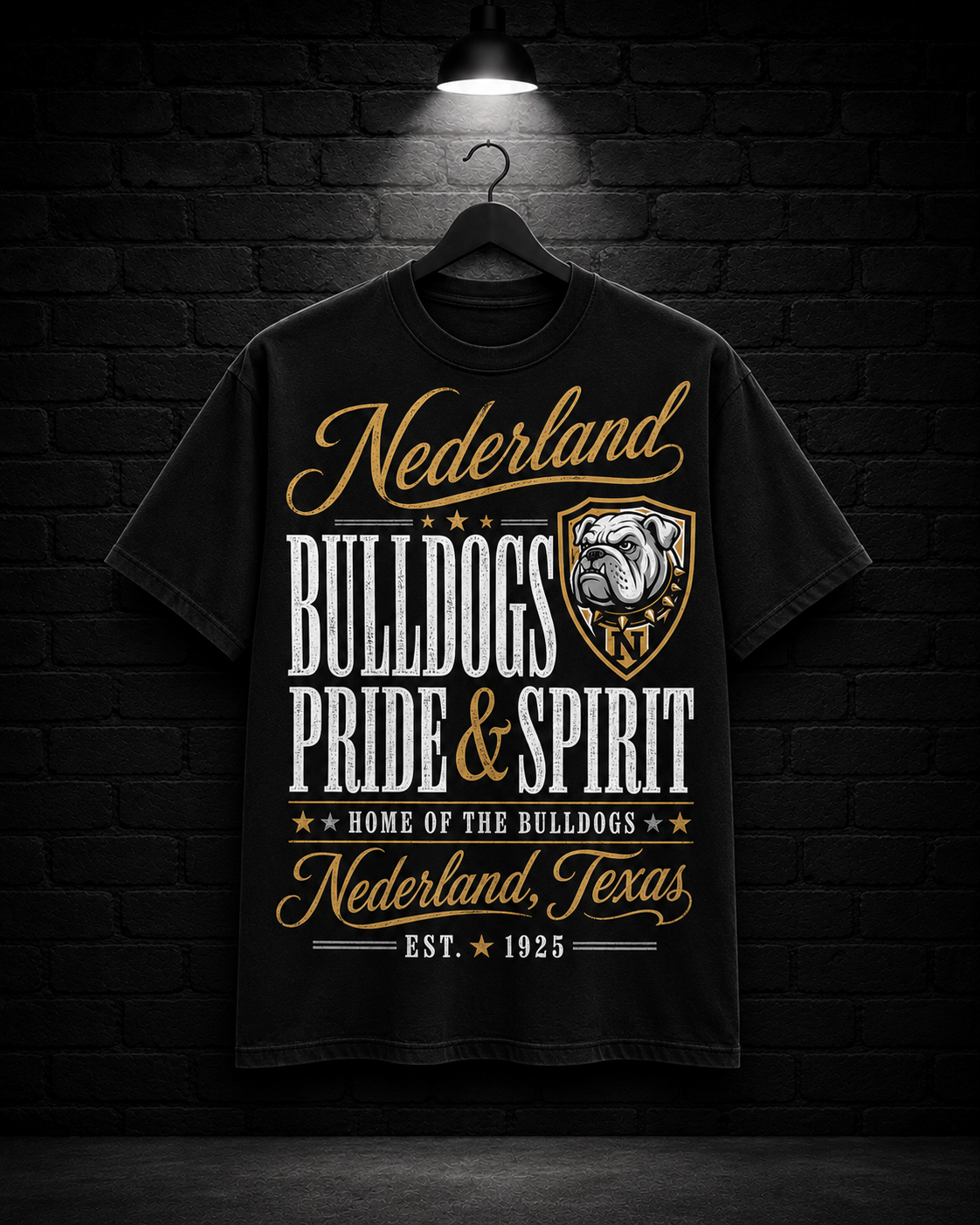 Nederland Bulldogs Pride & Spirit Tee on the 25/8 matte black brick studio background with black hanger and overhead spotlight