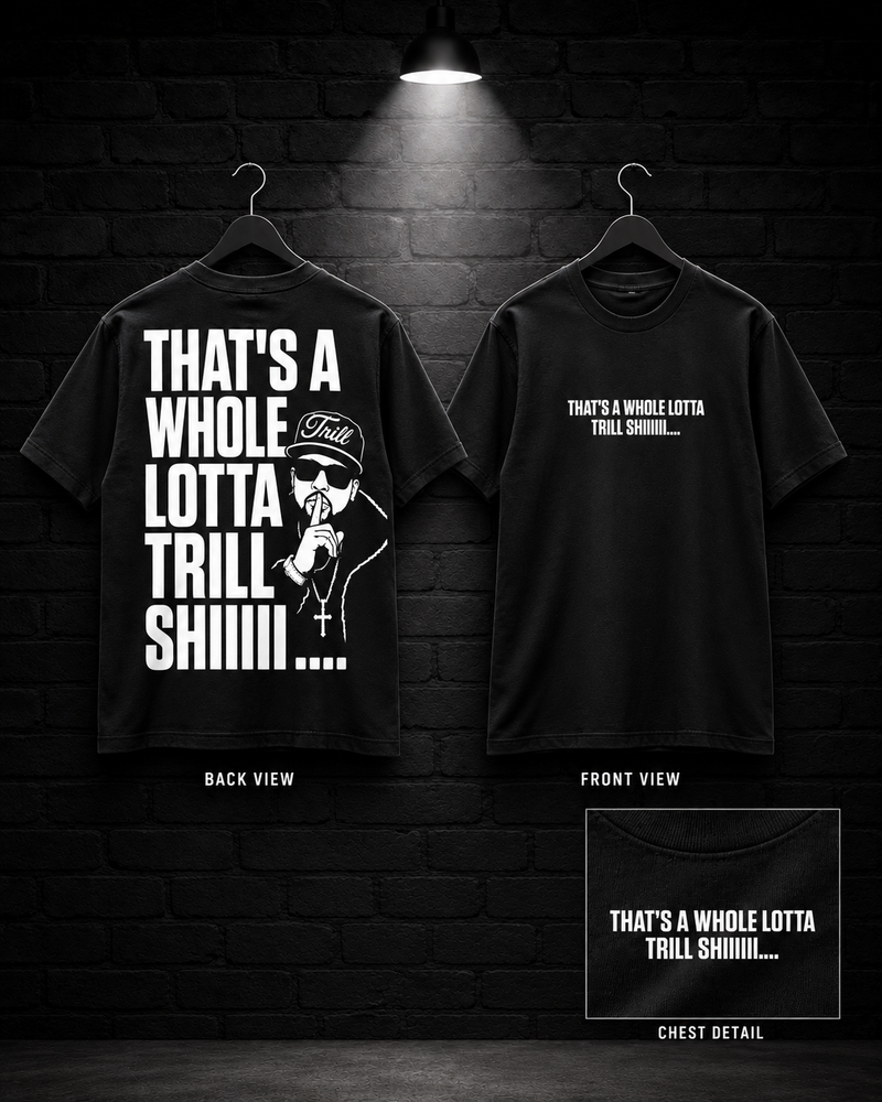 Whole Lotta Trill Graphic Tee on the 25/8 matte black brick studio background with black hangers and overhead spotlight