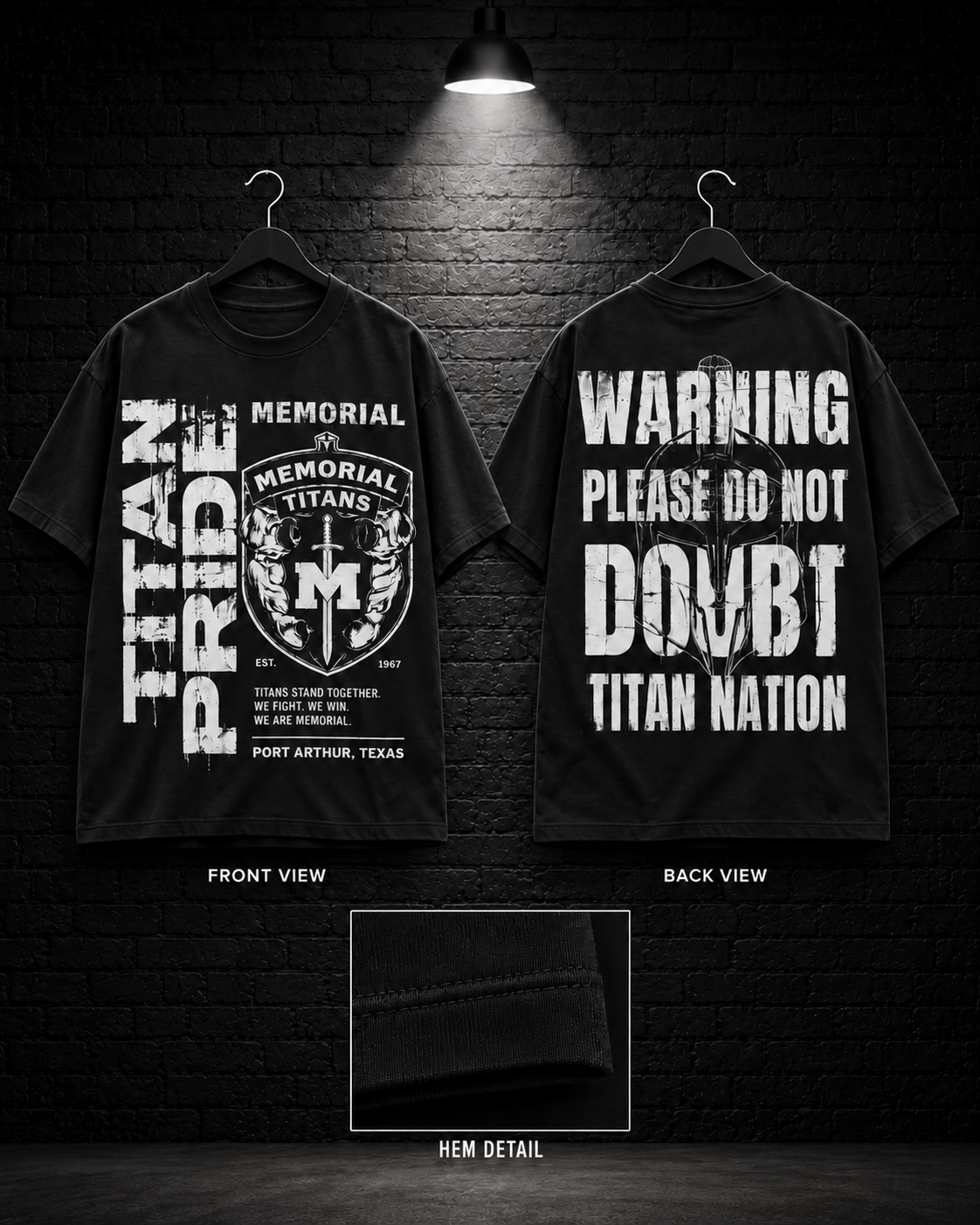 Memorial Titan Pride Shield Crest Tee on the 25/8 matte black brick studio background with black hangers and overhead spotlight