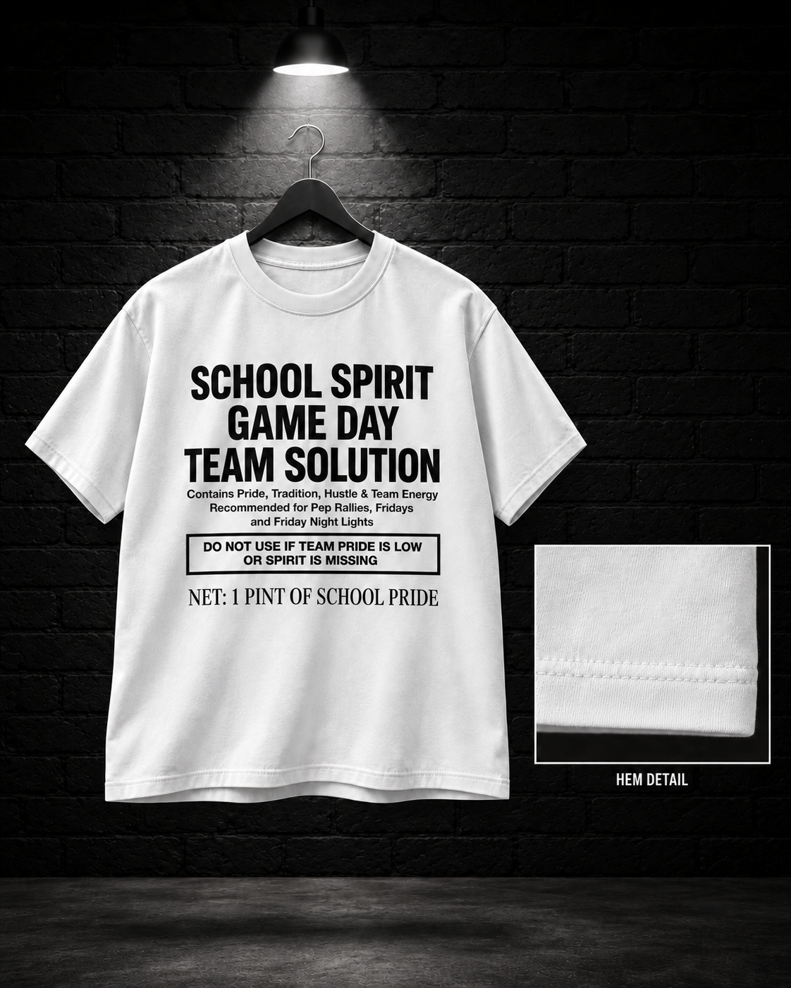 School Spirit Game Day Team Solution Tee on the 25/8 matte black brick studio background with black hanger and overhead spotlight